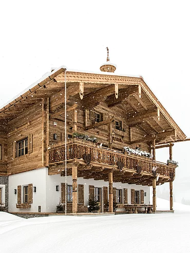 Winter exterior view of the luxurious Schmiedalm - the chalet in Saalbach Hinterglemm