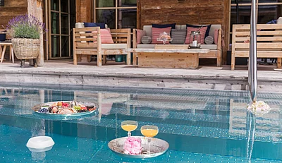 The outdoor pool at the Schmiedalm - the chalet in Saalbach Hinterglemm