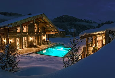 Winter exterior view of the luxurious Schmiedalm - the chalet in Saalbach Hinterglemm