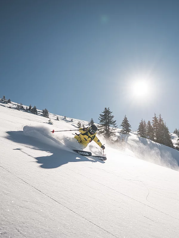 A freerider in deep snow in Saalbach Hinterglemm