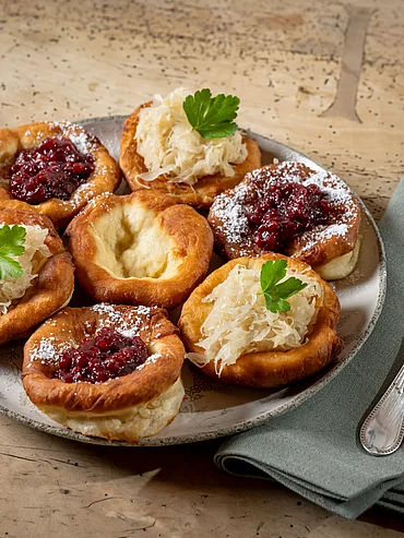 Delicious doughnuts with sauerkraut and cranberry jam