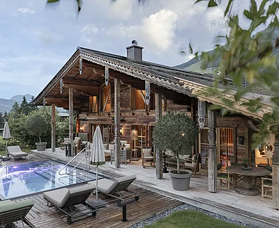 Ansicht Chalet mit Outdoor Pool des Luxuschalets Die Schmiedalm in Saalbach Hinterglemm, Österreich im Sommer