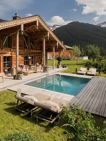 Outdoor pool Exterior view of the luxurious Schmiedalm - the chalet in Saalbach Hinterglemm