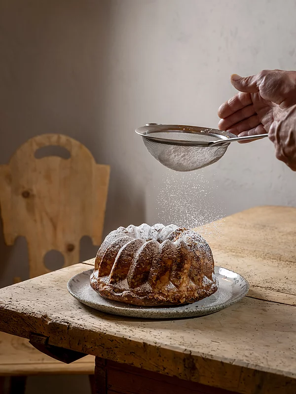 A Gugelhupf dusted with sugar in the Schmiedalm - the chalet in Saalbach Hinterglemm
