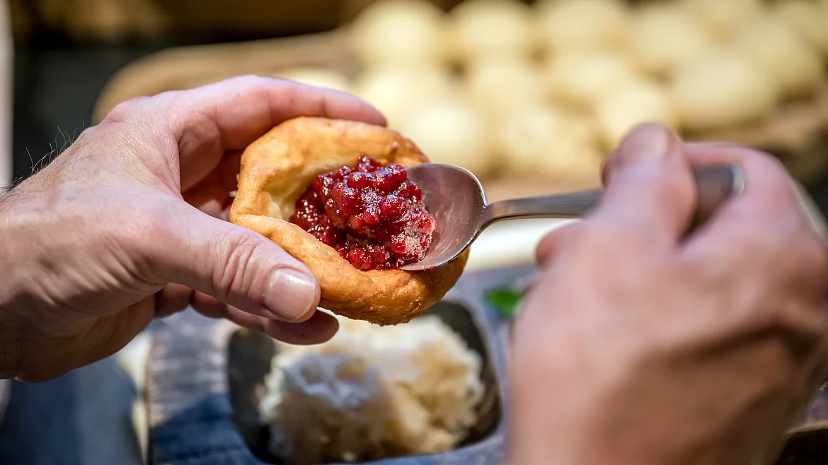 A doughnut with cranberry jam at the Schmiedalm